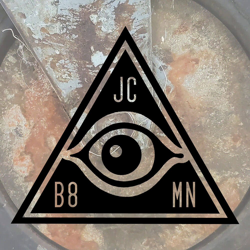 JC B8MN Triangle Eye Logo